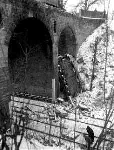 SC 199011-S - An old Sherman tank, (prime mover) that crashed through a bridge on the outskirts of Saverne and dropped 50 feet. photo