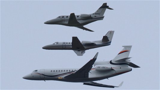 Three business jets in different sizes at 4100 ft.: photo