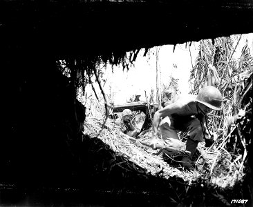 SC 171587 - Photo of men advancing under fire, somewhere on New Guinea.