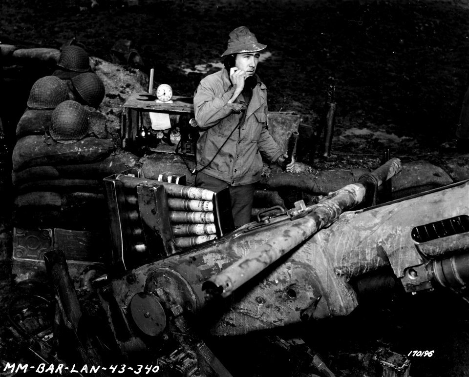SC 170196 - Pvt. Edward Leatherwood, Chatanooga, Tenn., of an anti-aircraft regiment, giving enemy aircraft alarm by phone and bell. North Africa.