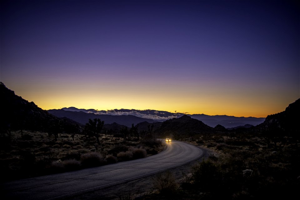 Car at sunset on Park Boulevard near West Entrance