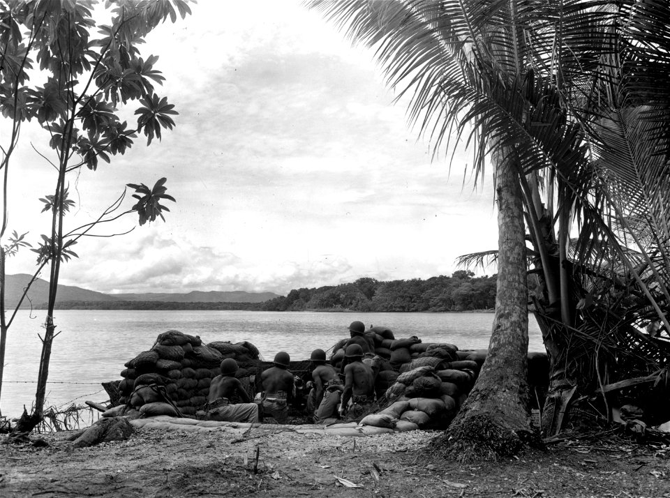 SC 329679 - Soldiers of the 24th Infantry in New Georgia, man a 37mm gun used for beach against the enemy. 15 October, 1943.