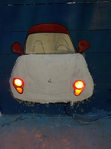 Cartoon car painted wall headlight photo
