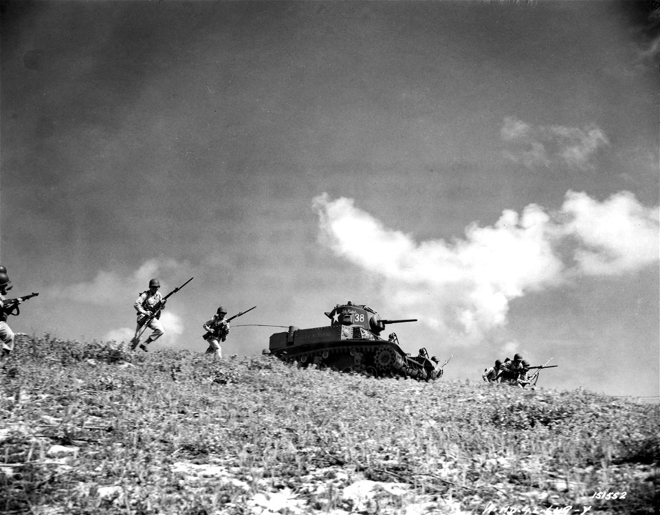 SC 151552 - Yes, like other doughboy outfits on the island employs tanks. Regular tank officers and men are in command of and operate the Panzer Buggies, but the infantrymen like to work with them. photo