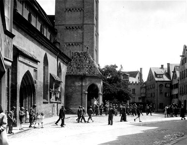 SC 335348 - Catholic soldiers of the 80th Infantry Division leave 500 year-old German church where they attended mass in Kaufbeuren, Germany. photo