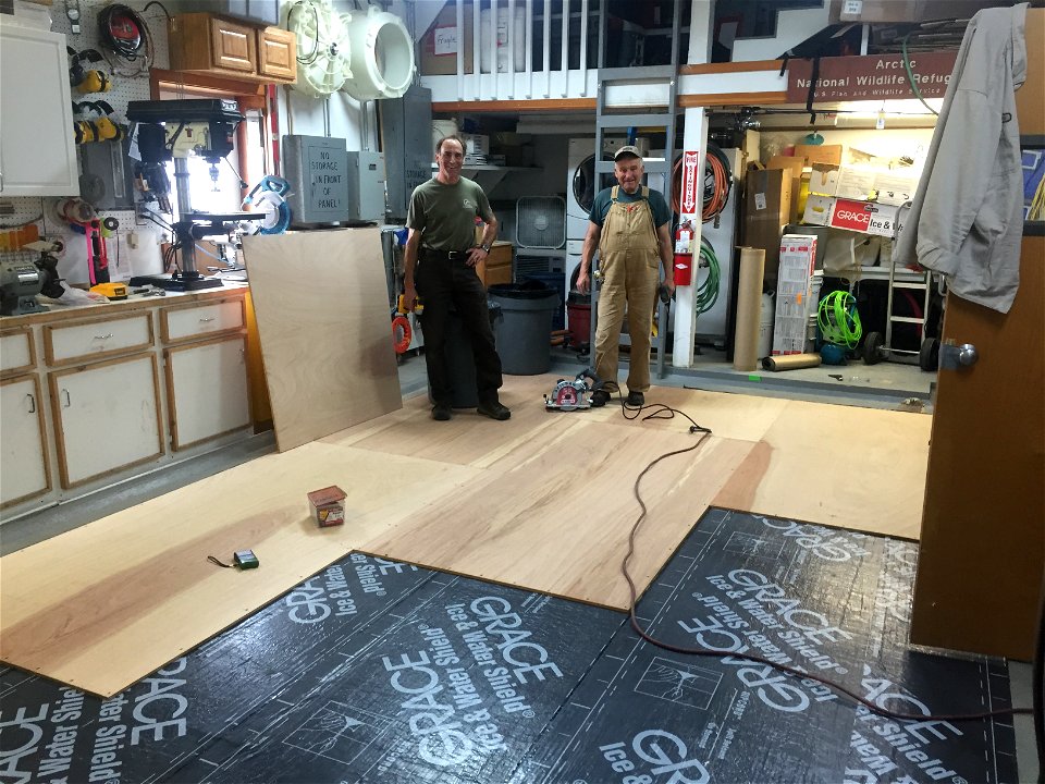 R7ArcticNWR Volunteer Roger replacing floor in Barter Island Bunkhouse