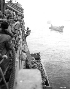 SC 171522 - Over the side and into the landing boats go the men of the landing party - Attu bound. 11 May, 1943. photo