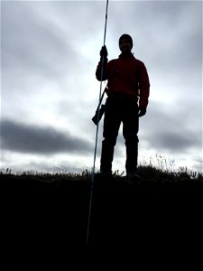 2015_Arctic_SC_Kaktovik Craig Connolly measures permafrost depth on shore of Kaktovik Lagoon
