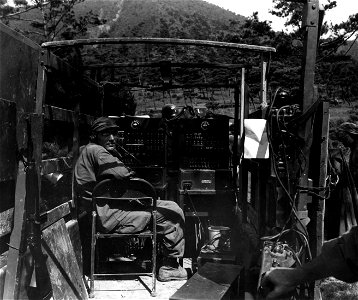 SC 348649 - Cpl. Allen Layton sets up radio station at advance post near Yongsan, Korea. 15 September, 1950. photo