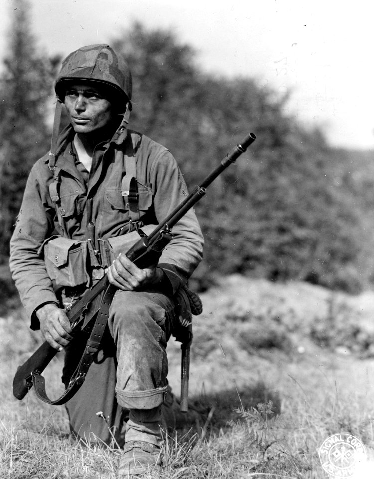 SC 364272 - Pfc. Floyd Rogers, 24, of Rising Star, Texas, and his Browning Automatic Rifle, with which, according to his officers, he has killed 27 Nazis, mostly snipers harassing advancing American troops. photo