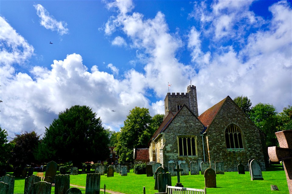 Chevening Church. One Lancaster and two Spitfires passing overhead.
