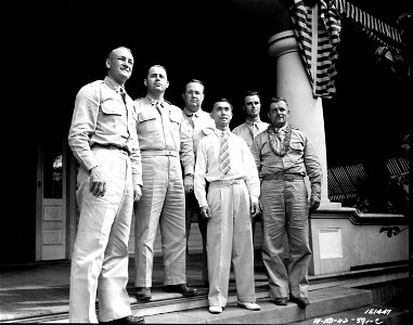 SC 151447-  At the party, are Col. John Roosma, Lt. Vandergrift, M/Sgt. Robert Thomason, Mr. Clarence Chun Hoon, Sgt. Charles Marsis, and Col. William L. Nave. Hawaii. At the aloha party by the Schoefield Quarter Back Club are six officers. T.H.
