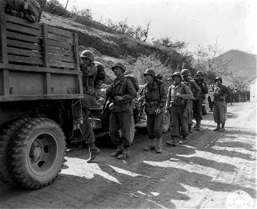 SC 270869 - Infantrymen of Co. "I", 3rd Bn., 85th Regt., 10th Mtn. Div., entruck to move to more forward positions. 17 April, 1945. photo