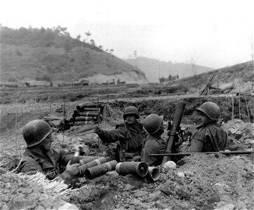 SC 364041 - Members of mortar crew of French Bn. prepare to blast enemy-held positions in hillside, during action against the communist forces near Oum-Ni, Korea. photo