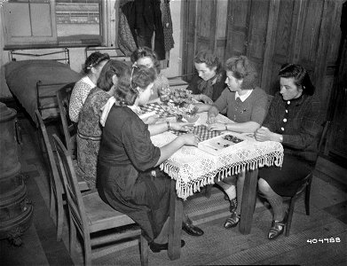 SC 404988 - Russian refugees taken from German-held territory are housed at Geserne Major Cogniau Barracks, in charge of U.S. Civil Affairs Unit. 23 September, 1944.
