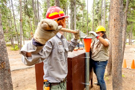 YCC Alpha Crew 2021 Canyon Campground bear box installation: filling support post with concrete