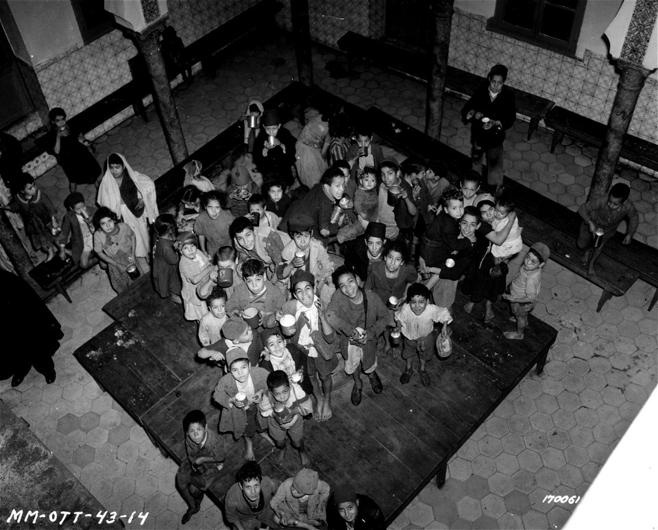 SC 170061 - Arabic children with their daily ration of milk at a school in N. Africa. 24 February, 1943.