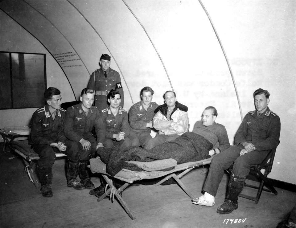 SC 179884 - Seven prisoners captured when a German Focke Wulf Condor was shot down off the north coast of Iceland by USAAF fliers, August 5th.