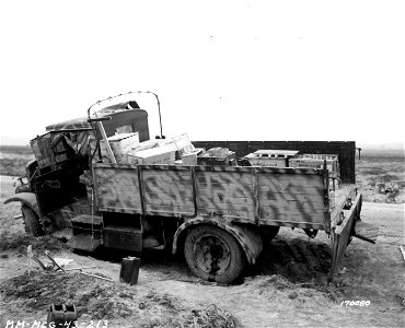 SC 170080 - Italian truck and ammunition left by the side of the road by retreating Axis forces in face of Allied advance. photo