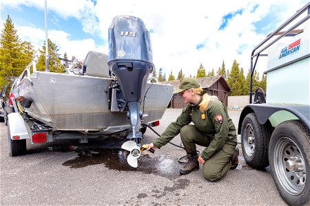 Heyley, AIS Technician, measuring water temperate for engine flush