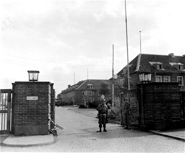 SC 335331 - American guards stand at the entrance to Displace Persons Camp at Krefeld, Germany.