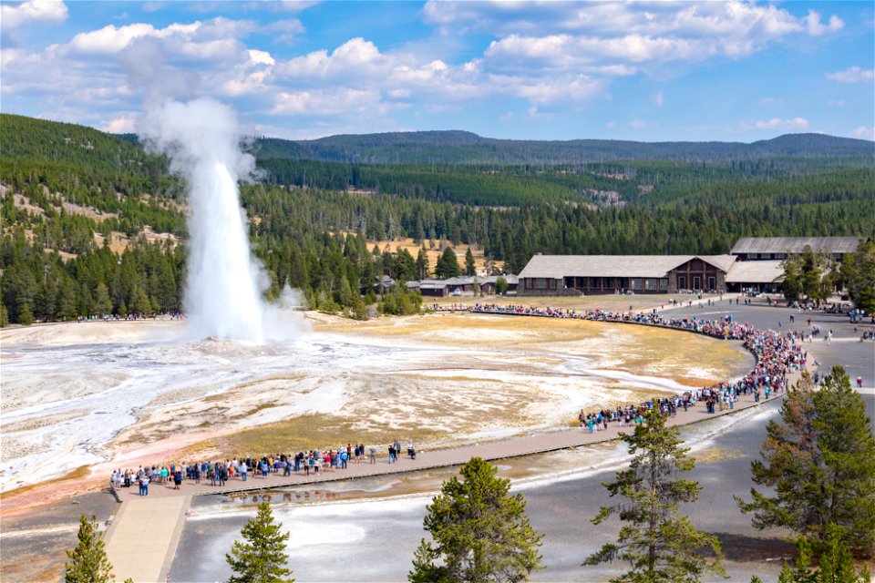 Visitors watching an Old Faithful eruption in September 2021 photo