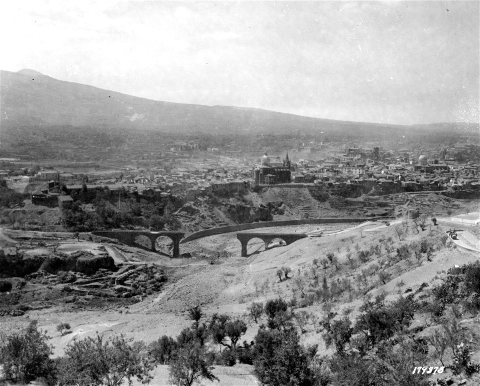 SC 179878 - Large bridges near Randazzo, Sicily, blown out to slow down Allied advance. Slopes of Mt. Etna visible in background. 14 August, 1943.