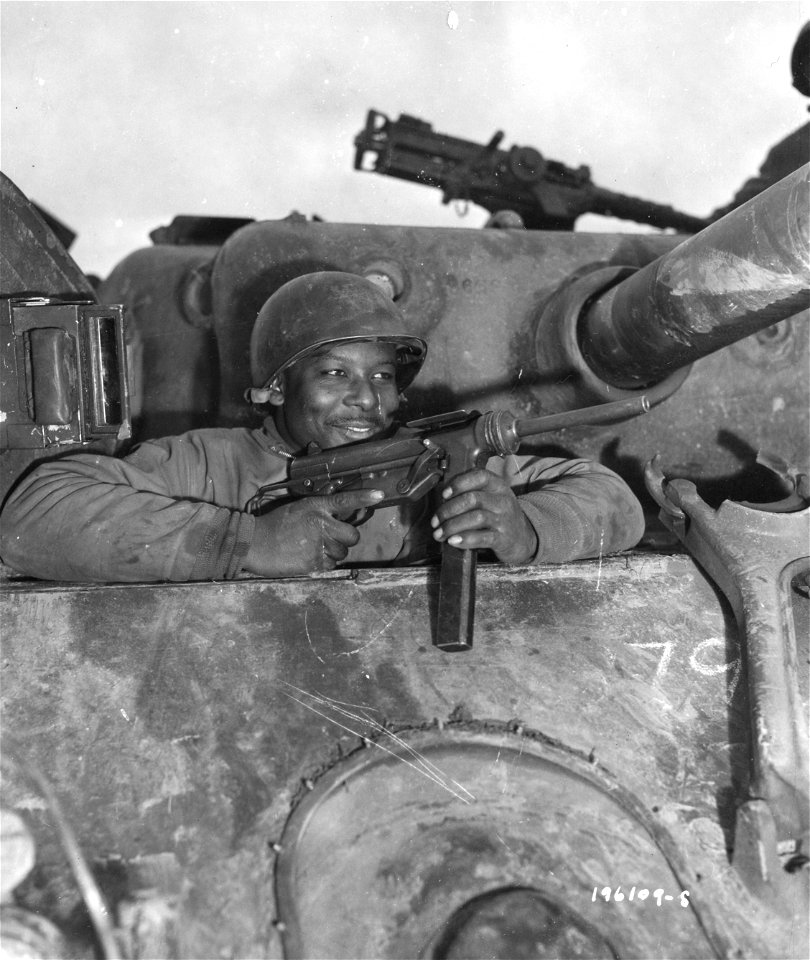 SC 196109-S - Pvt. Nathaniel Simmons, Beaford, S.C., is the assistant driver of an M-4 tank, somewhere in France. Nancy. 5 November, 1944.