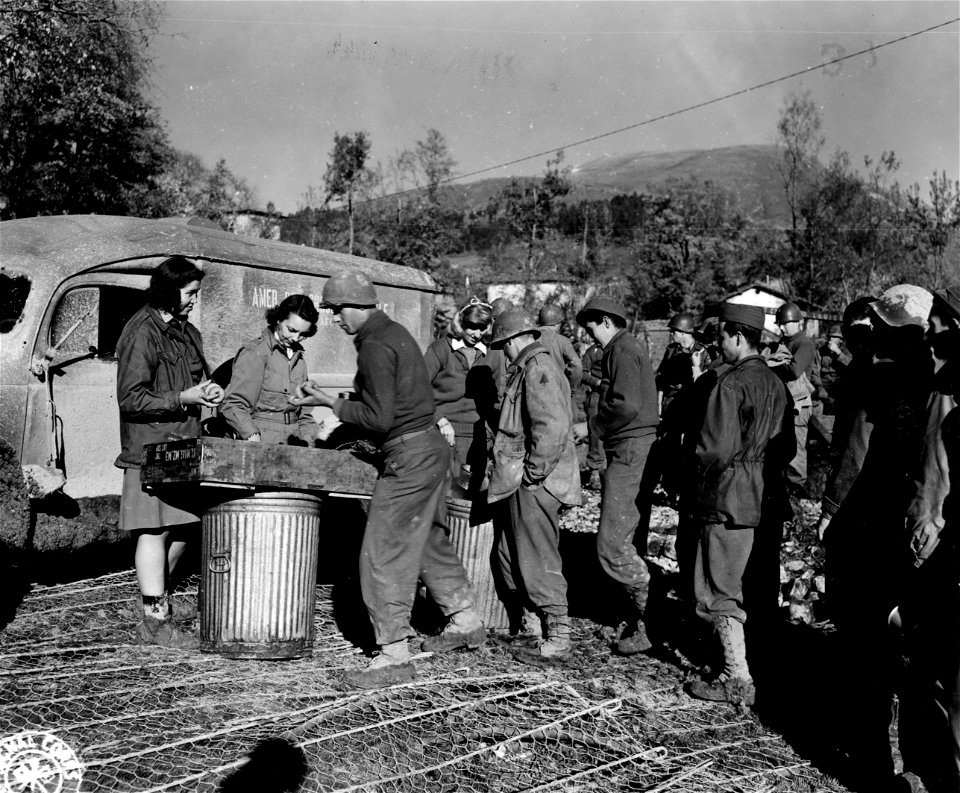 ARC workers distribute coffee and doughnuts to 91st Div. replacements near the Fifth Army front. photo