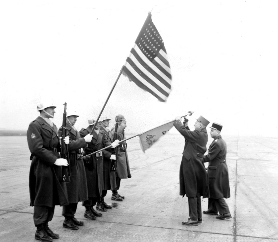 SC 364139 - Gen. Bertrand presents Croix De Guerre to 4th Recon Honor Guard. Air strip Camp McCauley, Linz, Austria. 24 January, 1951.