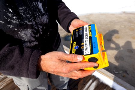 Mike Poland, USGS Scientist-in-Charge, replacing batteriest in a data logger photo