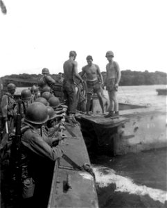 Transferring from Higgins Boats to amphibious tractors. Guadalcanal. 10 March, 1944.