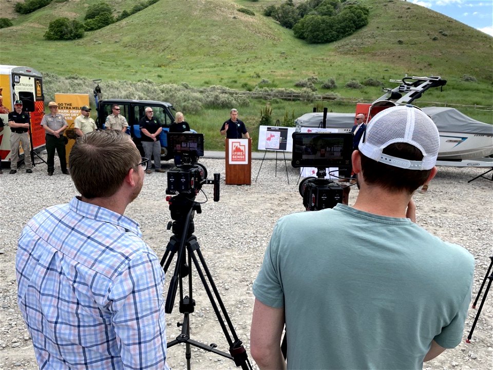 Presenters being filmed by the media