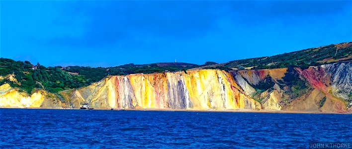 Alum Bay Isle of Wight The sands are coloured due to oxidised iron compounds formed under different conditions.