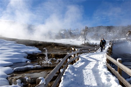 Visitors explore the boardwalk near Mound Terrace in Mammoth Hot Springs (1) photo