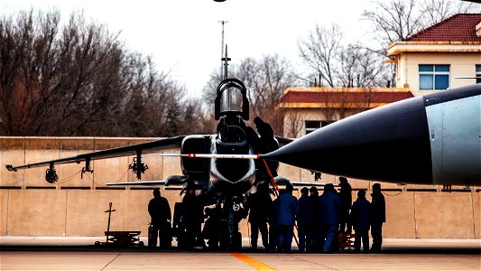 JH-7 Fighter Bomber Being Serviced