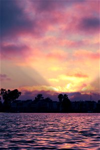 Row of condos on the water at sunset