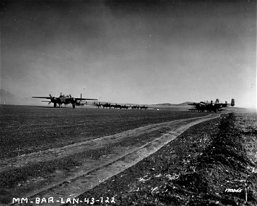 SC 170045 - B-25 bombers taking off for a raid. Berteux, North Africa. 12 February, 1943.