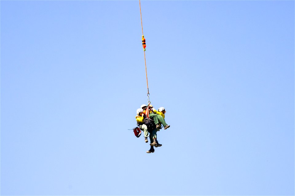 Yellowstone Helitack short-haul training: crew hauling patient to safety (4)