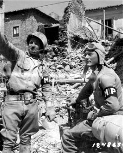 SC 184865 - Pfc. Norman Ridge, Langhorne, Pa., and Pvt. John H. Christopher, Abbeville, S.C., direct removal of bodies from wreckage, near Barrafranca, Sicily. 19 July, 1943.