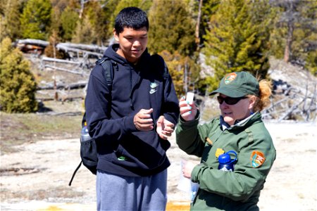 St. Stephens student helps with a geyser demonstration