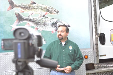 Aaron Woldt does an interview on the partnerships between Fish and Wildlife Service and state agencies photo