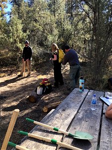 A group of kids learn about forest science at an Every Kid Outdoors Field Day