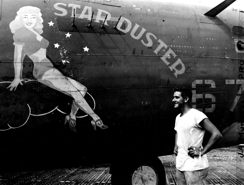 Pin-up girl influence is apparent on many of the Army's Liberator bombers in the pictures of scantily-clad girls on the sides.