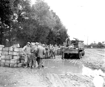SC 195522 - Trucks are loaded with supplies for various combat units at a supply depot near Eupen, Belgium. 16 October, 1944. photo