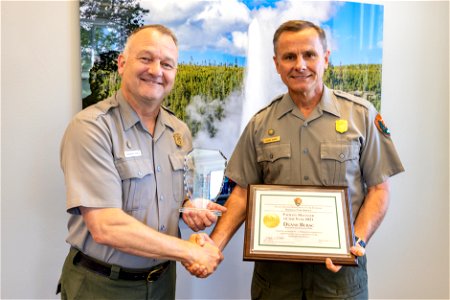 Superintendent Cam Sholly presents Facilities Chief, Duane Bubac, with NPS Facility Manager of the Year 2021 award
