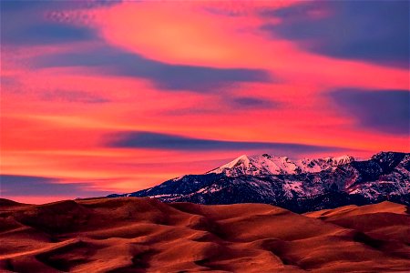 Colorful Sky over Dunes and Cleveland Peak photo