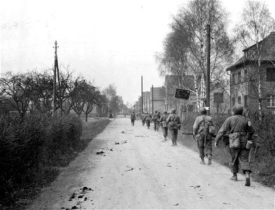 SC 270688 - Infantrymen of the 5th Division, 3rd U.S. Army, enter the town of Hasslach, Germany, near the river Rhine. 25 March, 1945.