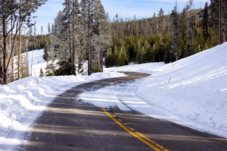 Spring biking road conditions 2023: snow drifting around blind conrers