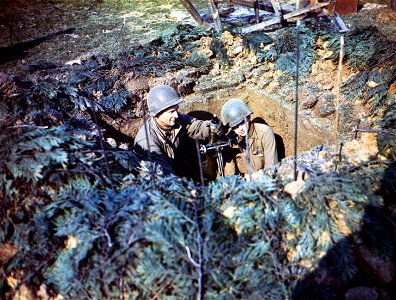 C-868 - Members of Co. D, 39th Inf. Regt., 9th Div., prepare to fire their mortar from newly-captured ground in Germany. photo